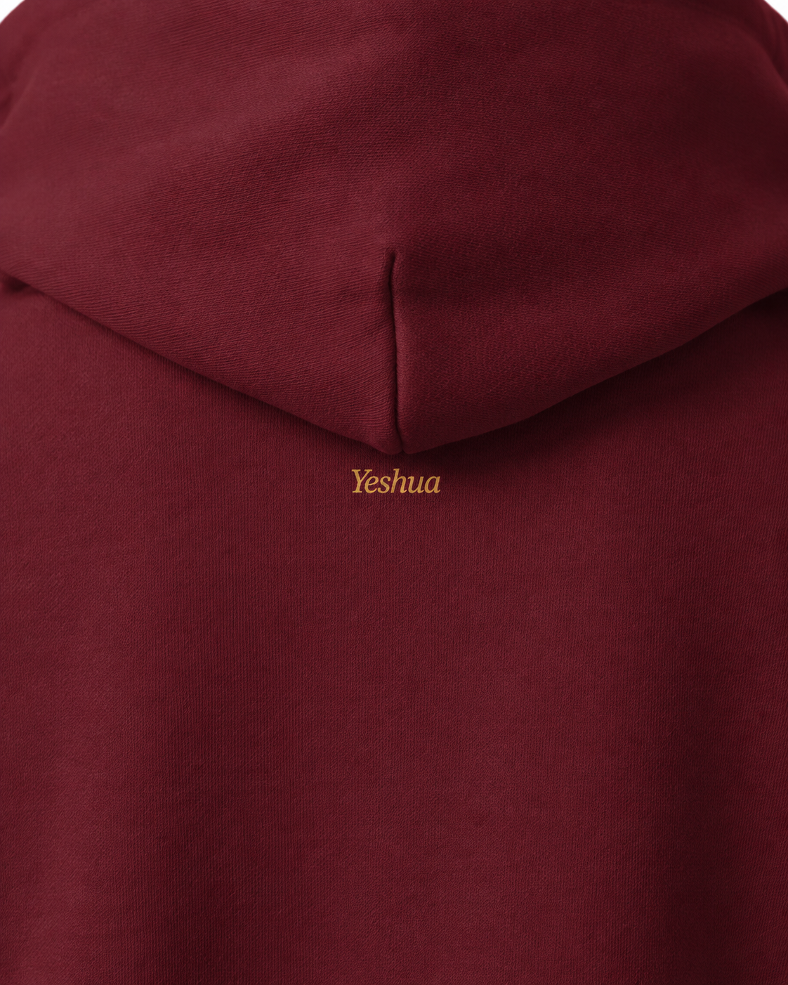 No Luck, All God oversized heavyweight hoodie in maroon – close-up of the small gold Yeshua print beneath the hood